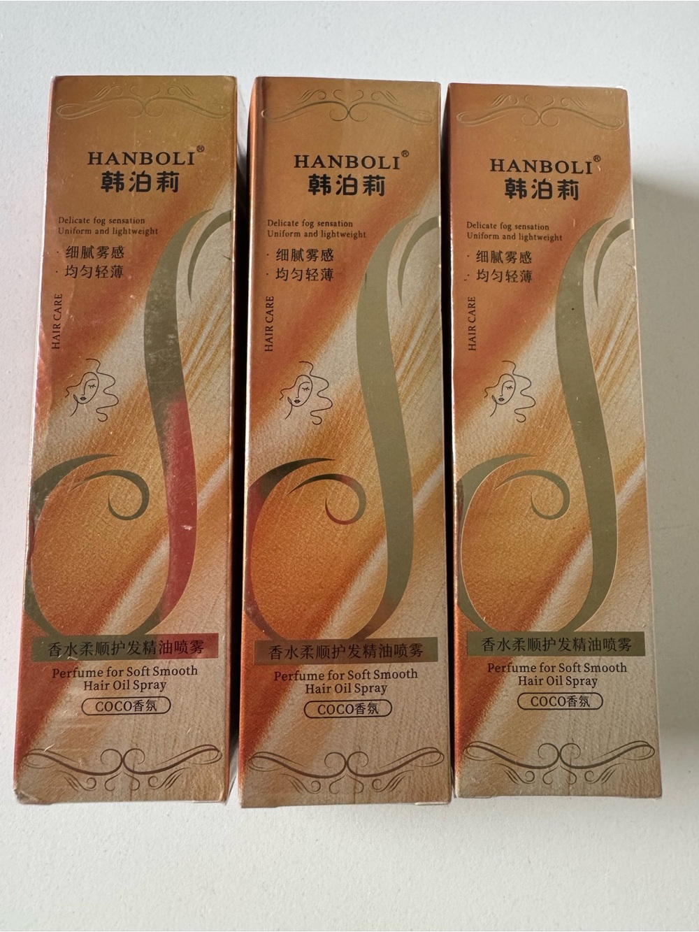 Amazon HANBOLI Hair Oil Serum 3 Spray Boxes in Gold and Brown